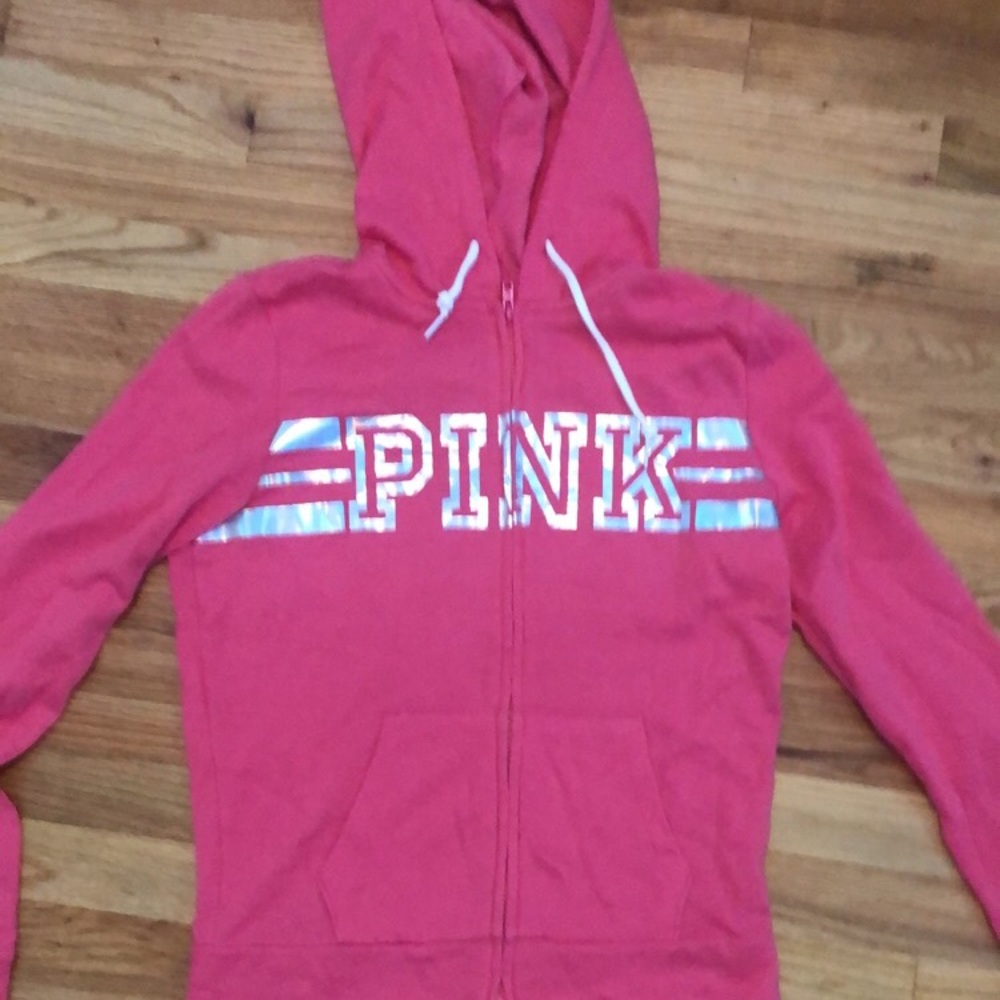 Pink zip up sweatshirt with silver pink letters